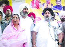 SAD chief Sukhbir Badal with party candidate Paramjit Kaur Gulshan in Faridkot on Tuesday