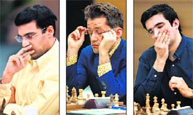 Viswanathan Anand played out an easy draw against Shakhriyar Mamedyarov, while Levon Aronian (centre) drew with Veselin Topalov and Vladimir Kramnik (right) lost to Peter Svidler in the 10th round of the Candidates Chess tournament on Tuesday