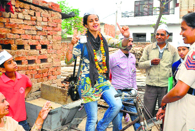 AAP candidate Gul Panag campaigns at Hallo Majra in Chandigarh on Wednesday.