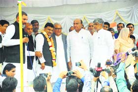 Chief Minister Bhupinder Singh Hooda welcomes BJP rebel leader Pradeep Sangwan in the Congress in Gohana on Wednesday