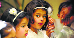 Children wait for their turn to perform during the annual function of St Xavier Playway School, Ludhiana.