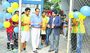 Dr Rajoo Singh Chhina, Dean, Academics, DMCH, Ludhiana, inaugurates a football tournament on Wednesday.