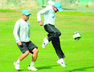 One good thing about this team is that the players seem to enjoy each others company, which comes across in their lively training sessions. Here MS Dhoni and Ravindra Jadeja fight for the ball.
