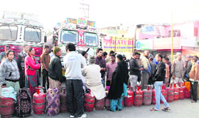 A long queue of consumers at the Haridwar road gas godown in Dehradun on Thursday.