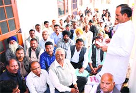 BJP state president Satpal Singh Satti addresses a party workers meeting in Una on Thursday