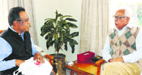 Governor NN Vohra interacts with Director, National Book Trust, MA Sikandar at Raj Bhawan in Jammu on Thursday. A Tribune photograph