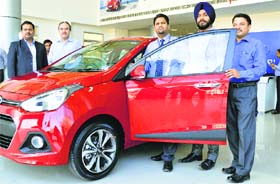 Hyundai Motor India Limited launches its new family sedan, Xcent, in Ludhiana on Thursday