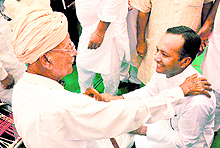 MP Naveen Jindal greets an elderly man during canvassing