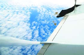 Severe turbulence: Excess fuel is dumped from a nozzle protruding from the left wing of a Royal Australian Air Force AP-3C Orion aircraft before landing on Thursday