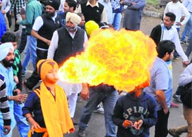 Fiery campaign: A Sikh youth performs skilfully during Congress candidate Capt Amarinder Singhs roadshow in Amritsar on Friday