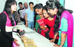Students click photographs of manuscripts displayed during an exhibition by the National Mission for Manuscripts at DAV College, Jalandhar, on Thursday. Tribune photo: Malkiat Singh 