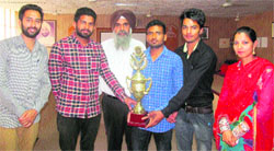 Students of PTU GZS College being honoured for their achievements in an athletics meet in Bathinda on Friday. A Tribune photograph