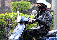 A commuter caught unawares by rain in Chandigarh on Friday