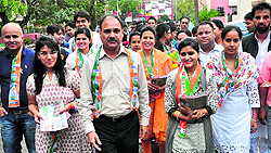 Shaina Bansal (second from right) campaigns for her father-in-law and Congress candidate Pawan Kumar Bansal in Sector 18, Chandigarh, on Friday