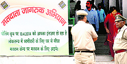 A board displayed at the Mansa Devi temple urging voters to exercise their right to franchise