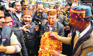 BJP candidate Shanta Kumar with party workers in Dharamsala on Friday.