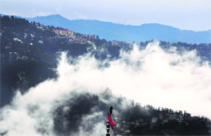 Fog envelops Shimla during rainfall on Friday.