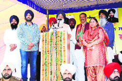 Chief Minister Parkash Singh Badal addresses a rally at Ghasipur village in Hoshiarpur district on Friday. Tribune photo