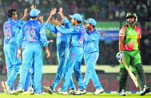 Ravichandran Ashwin gets a high five from teammates after the dismissal of Tamim Iqbal. Leggie Amit Mishra was on fire yet again, returning with three wickets.
