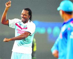 Chris Gayle celebrates victory over Australia on Friday.