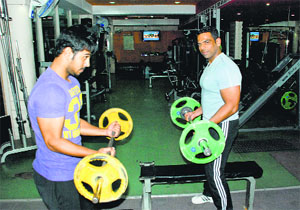 Gaurav Sood (R) advises tailored exercise schedules for those with special needs