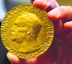A bidder Ole Bjorn Fausa holds the 1936 Nobel Peace Prize in Baltimore, US, on Thursday.