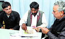 Umesh Kumar (centre), a fruit vendor, has come to Jalandhar from Mansa to look for his missing son and approached the Childhelpline to recover his child. He has also identified his son in the photograph that appeared in The Tribune on March 26