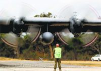 A Royal Malaysian Air Force C-130 Hercules, which is part of the team searching for the missing jet, lands in Perth on Saturday. AFP