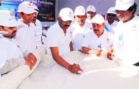 Divisional Commissioner R Venkatratnam takes part in a signature campaign in Amritsar on Sunday