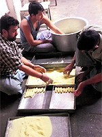 Workers at Manoj Sweet House prepare julie in Bathinda on Sunday