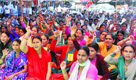 ASHA workers participate in a convention organised by the Centre of Indian Trade Unions in Dehradun on Sunday.
