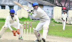 A batsman plays a shot during a match in the ONGC Inter-Departmental Cricket tourney in Dehradun on Sunday.