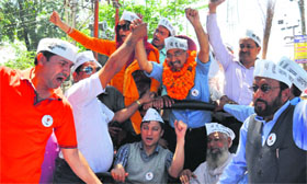 AAP candidate from Tehri Anoop Nautiyal participate in a roadshow in Dehradun on Sunday.
