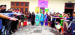 Students and staff of the Government College of Education take a pledge during the 'Save our Earth' programme in Jammu