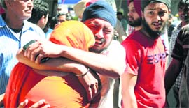 Grieving family members of the deceased at the accident site in Ludhiana on Sunday.