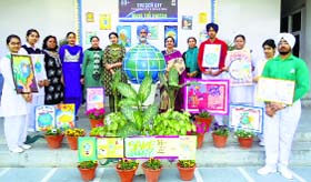 Students and staff observe Earth Hour at Guru Nanak International Public School, Model Town, in Ludhiana.