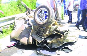 The mangled remains of the car that hit the divider on a bridge near Khanna on Sunday.