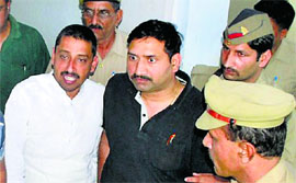 Cong candidate Imraan Masood (L) at a Saharanpur court.