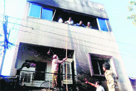 A view of buliding where seven members of a family were charred to death as they slept when fire engulfed their shop cum residence in Paratwada village in Amravati, Maharashtra district on Sunday.