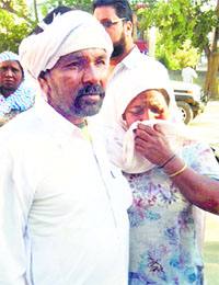 Relatives of the deceased in Patti on Sunday.