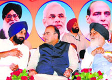 (R-L) Chief Minister Parkash Singh Badal, BJP candidate Arun Jaitley and Cabinet Minister Bikram Majithia in Majitha on Sunday.