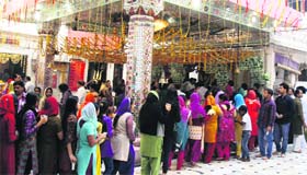 Devotees at a temple on the occasion of 'Navratra' in Amritsar on Monday.