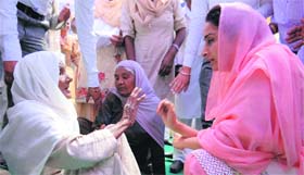 Bathinda, MP Harsimrat Kaur Badal listens to the grievances of an elderly woman at Virak Kalan village in Bathinda on Monday.
