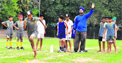 Players take part in hockey trials at the Sports Stadium in Sector 46, Chandigarh. Tribune photo: Parvesh Chauhan