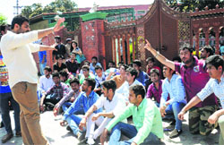 Students stage a protest oustide GGDSD College, Sector 32, in Chandigarh on Monday. Tribune photo: Manoj Mahajan