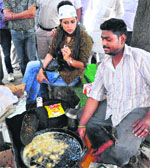 AAP candidate Gul Panag speaks to a tea vendor during her election campaign in Sector 33 on Monday. Tribune photo: Parvesh Chauhan
