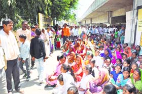 Up in arms: Class IV employees of the FCI protest against the management over their termination in Karnal on Monday