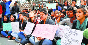 Activists of the All-student Association Polytechnic raise slogans outside the DC's office in Shimla on Monday.