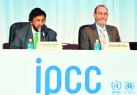Intergovernmental Panel on Climate Change (IPCC) Working Group II co-chairman Chris Field (R) delivers a speech while IPCC chairman Rajendra Pachauri (L) look on at a press conference in Yokohama, suburban Tokyo, on Monday