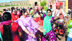 Devotees dance on the occasion of Navratras at a Kali temple in Jammu on Monday. Tribune photo: Anand Sharma